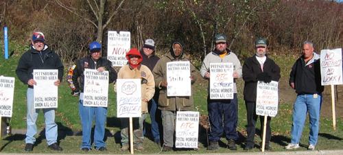 Striking Rood Trucking Company drivers hold pickets along with members of PMAPWU.