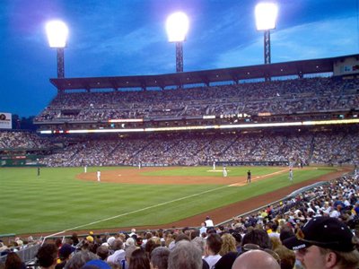 On the ball field, lights on overhead.