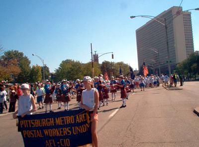 Our kids carry the banner for the parade