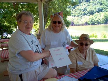 The sign in committee, ready to meet and greet old comrades